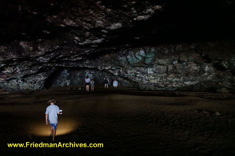 hawaii,travel,tourist,cave,beach,dark,black,flashlight,exploring,